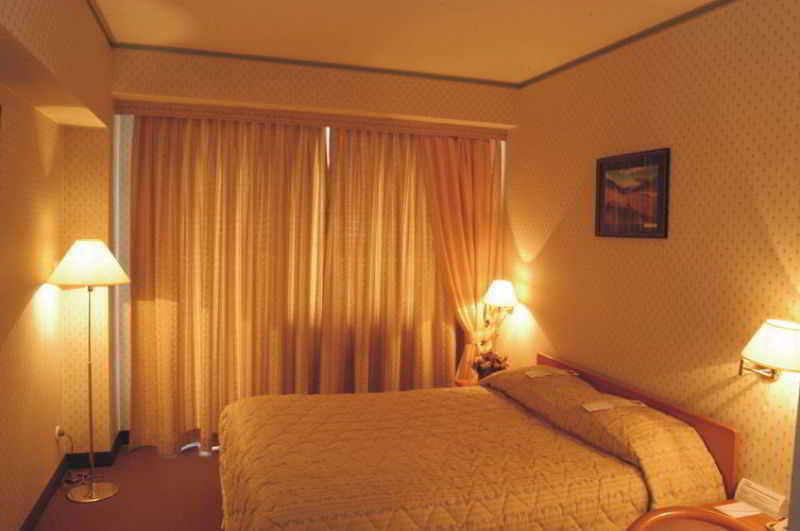 Astana International Hotel Almaty Quarto foto